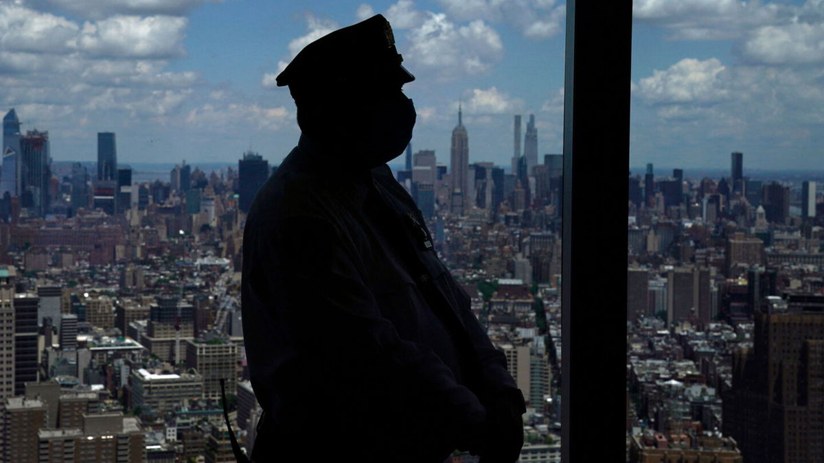 <i>TIMOTHY A. CLARY/AFP via Getty Images</i><br/>The NYPD issued a directive on December 20 mandating that all employees wear a mask while on the job