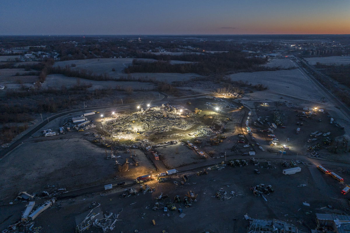 <i>Ryan C. Hermens/Lexington Herald-Leader/AP</i><br/>Workers at the Mayfield Consumer Products candle factory file a lawsuit against the employer. Pictured are search and rescue teams at the candle factory early December 12.