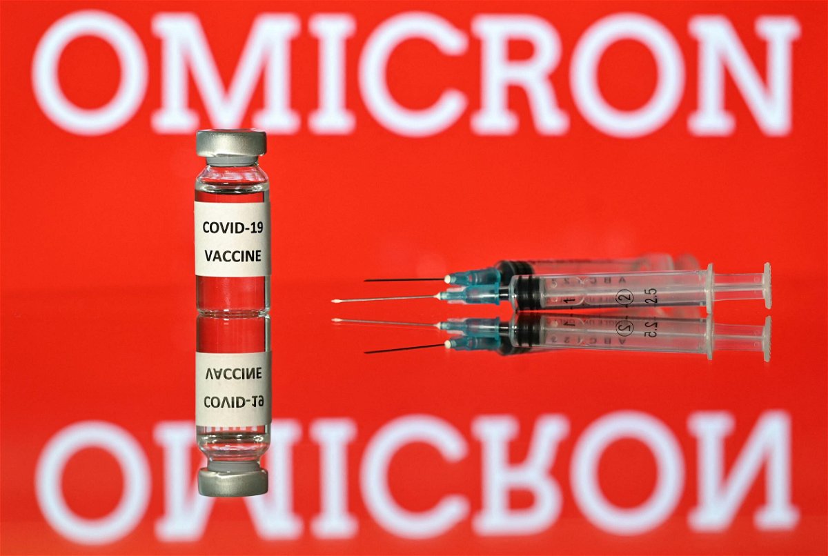 <i>JUSTIN TALLIS/AFP/AFP via Getty Images</i><br/>An illustration picture taken in London on December 2 shows a vial with Covid-19 vaccine sticker attached
