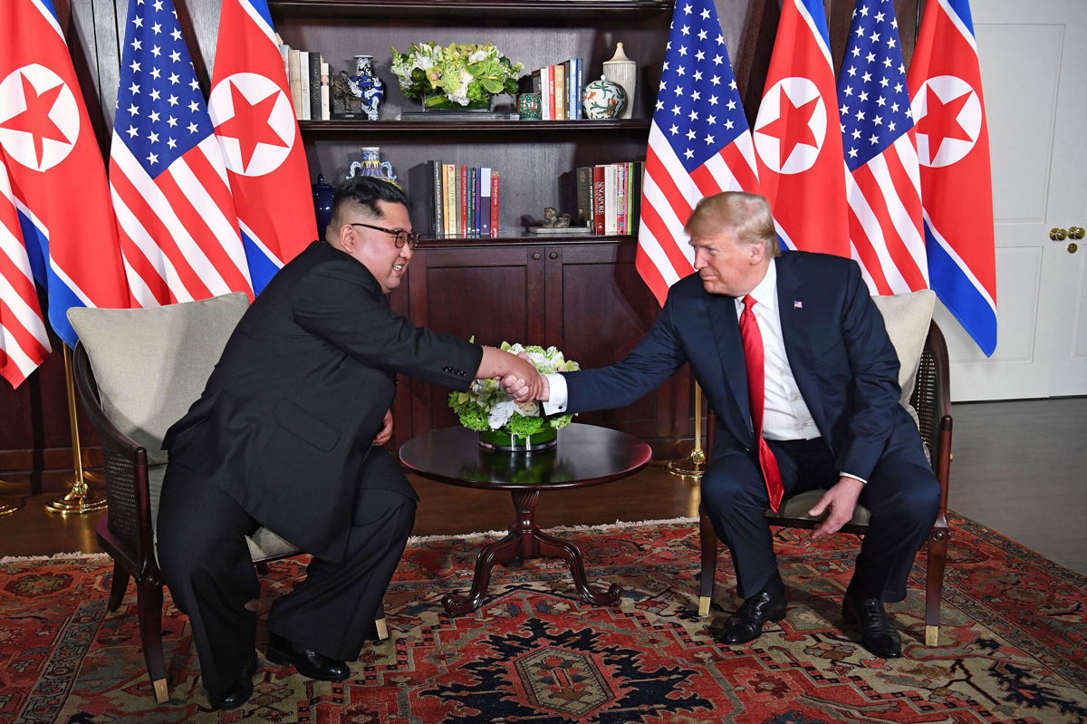 <i>Saul Loeb/AFP/Getty Images</i><br/>Kim Jong Un met then President Donald Trump in Singapore on June 12
