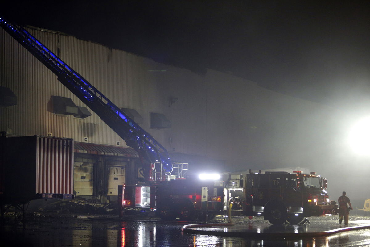 <i>Tom Copeland/AP</i><br/>Firefighters work on cleanup after a fire ripped through a distribution center for the QVC home shopping television network in Rocky Mount