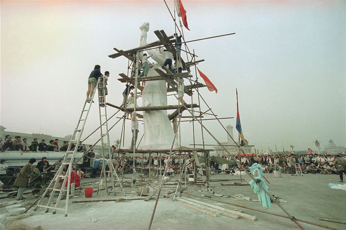 <i>Jeff Widener/AP</i><br/>Beijing University students put the finishing touches on the Goddess of Democracy in Tiananmen Square in Beijing