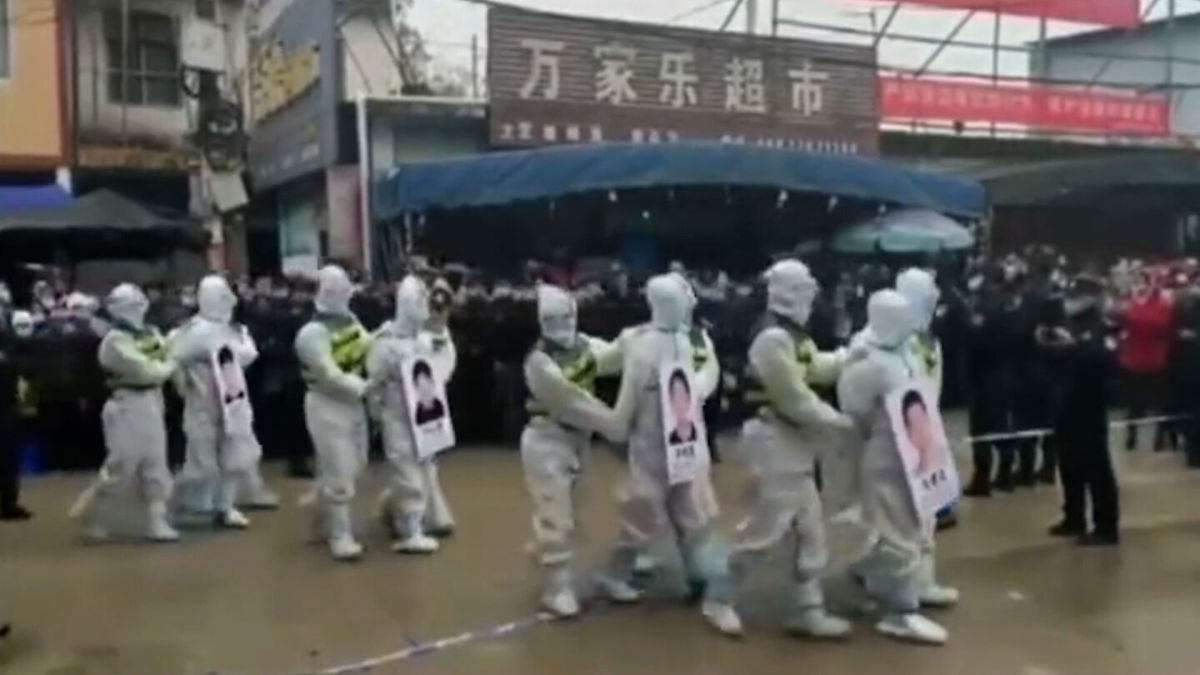 <i>Weibo</i><br/>Chinese police parade human smuggling suspects in public to shame them for violating pandemic rules.