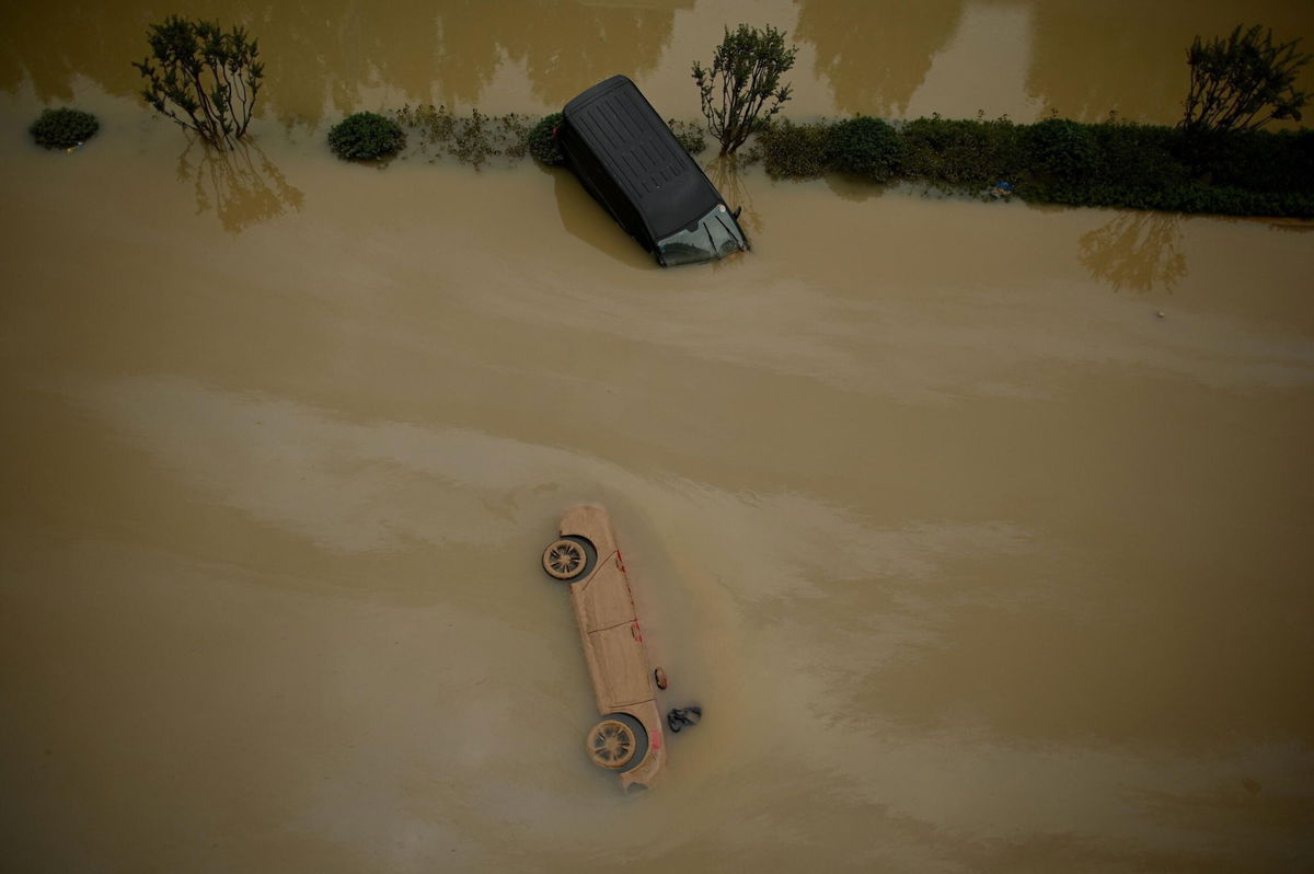 <i>Noel Celis/AFP/Getty Images</i><br/>Cars sit in floodwaters following heavy rain in Zhengzhou in China's central Henan province on July 22.