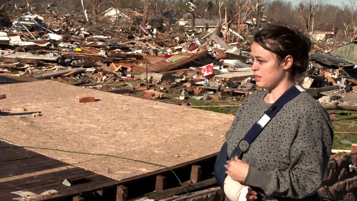 <i>CNN</i><br/>Tornado survivor Breeana Glisson beside what had been her home in Dawson Springs.