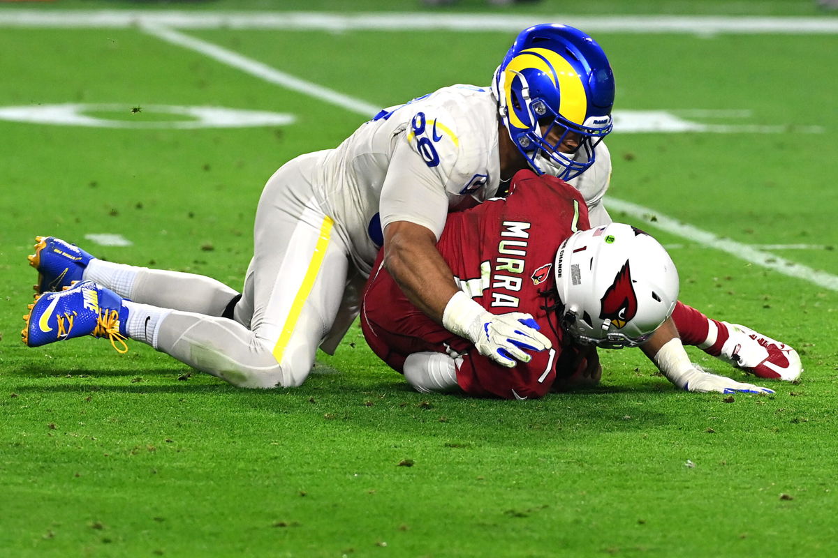 <i>Norm Hall/Getty Images</i><br/>Aaron Donald sacks Murray in the second quarter of the game at State Farm Stadium on December 13.