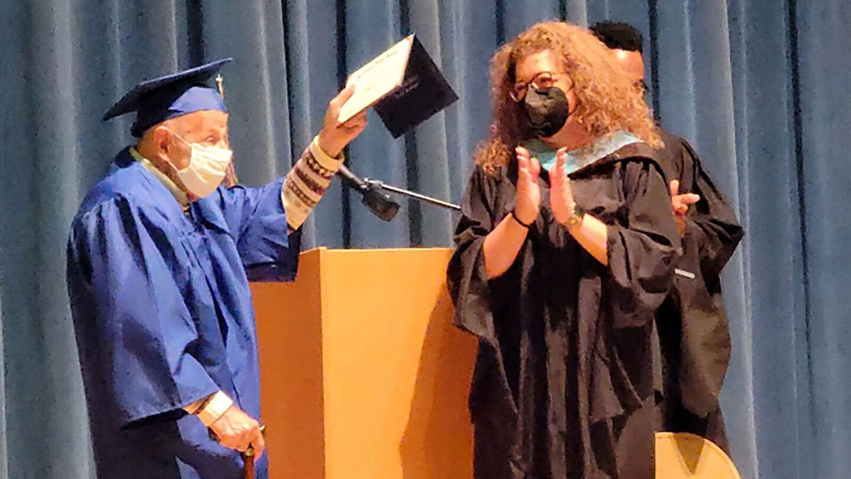 <i>courtesy Connie McLeod</i><br/>Ernie Reda receives his high school diploma from Stadium High School's principal