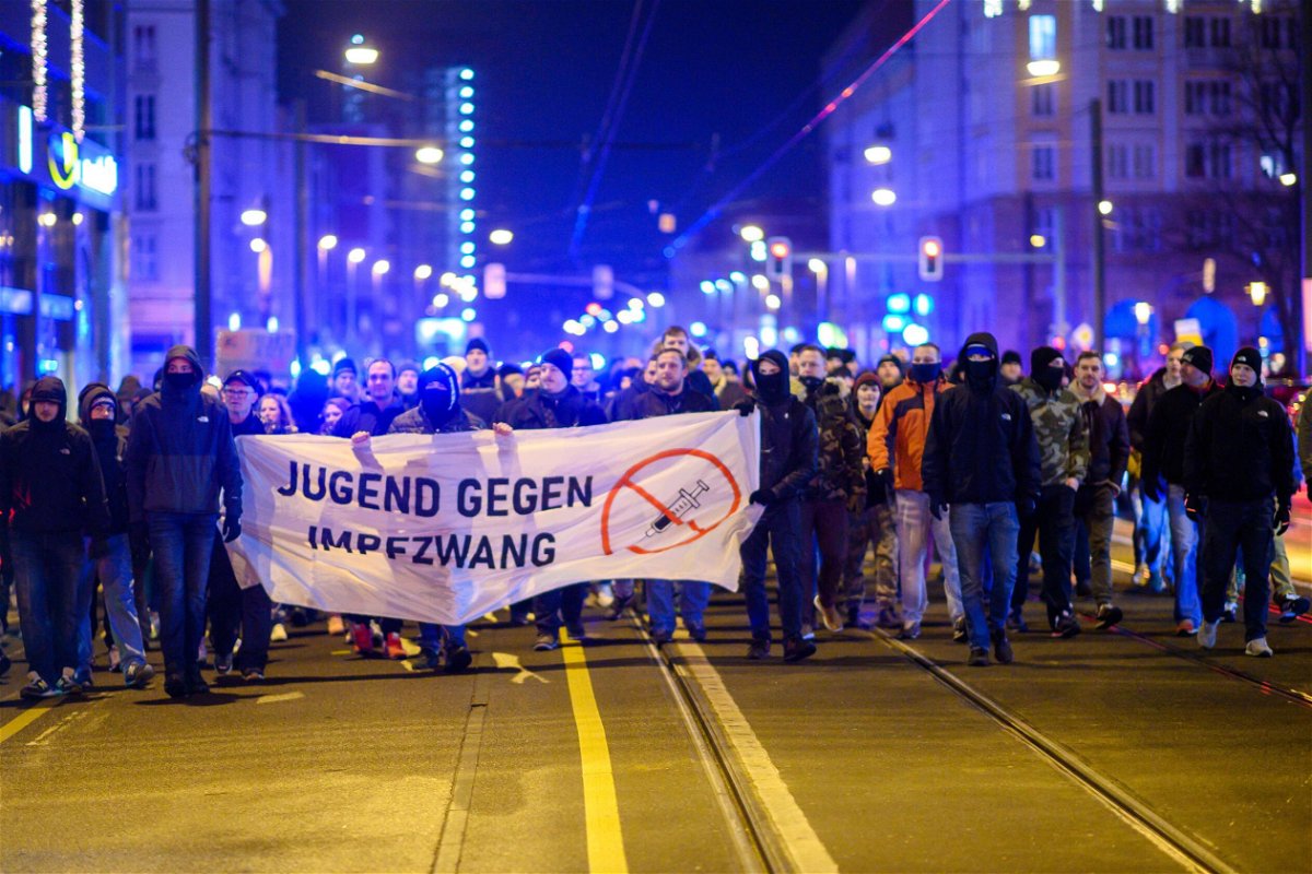 <i>Klaus-Dietmar Gabbert/picture alliance/Getty Images</i><br/>Demonstrators march through the city center of the capital of Saxony-Anhalt with a banner that reads 