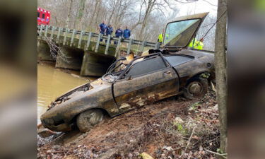 Investigators pull a 1974 Ford Pinto from a creek in Alabama.