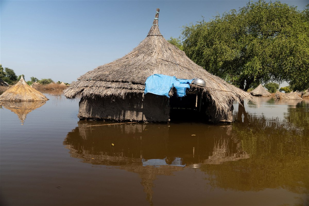 <i>Brent Swails/CNN</i><br/>A hut with a straw roof pokes out from the floodwaters in the town of Ding Ding.