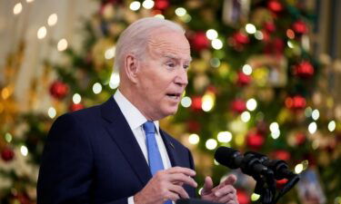U.S. President Joe Biden speaks about the omicron variant of the coronavirus in the State Dining Room of the White House
