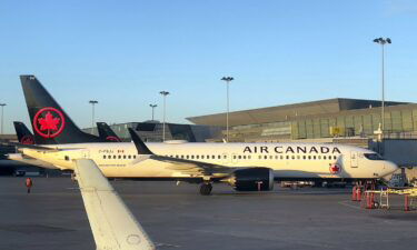 An Air Canada plane at Montreal-Pierre Elliott Trudeau International Airport (YUL) on October 3. Canada issued a travel advisory to its citizens Wednesday asking that they avoid all nonessential international travel as the Omicron variant spreads throughout the world.