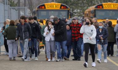 Parents retrieve their kids after the shooting at Oxford High School in Michigan on November 30.