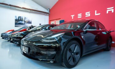 Tesla reported earnings that more than tripled year-ago results