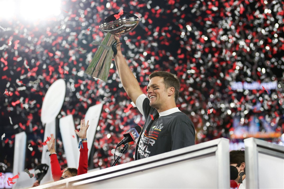 <i>Ben Liebenberg/AP</i><br/>Tampa Bay Buccaneers quarterback Tom Brady (12) holds the Vince Lombardi trophy following the NFL Super Bowl 55 football game against the Kansas City Chiefs