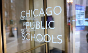 A sign is displayed on the front of the headquarters for Chicago Public Schools on January 5