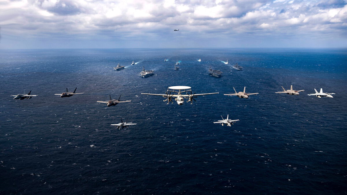 <i>US Navy</i><br/>Aircraft fly over a US-Japan naval flotilla that included two US aircraft carriers in the Philippine Sea on January 22.