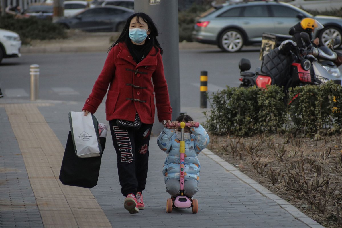 <i>Wu Hong/EPA-EFE/Shutterstock</i><br/>China's birth rate drops for a fifth straight year to record low. A girl here rides on a kids scooter in Beijing