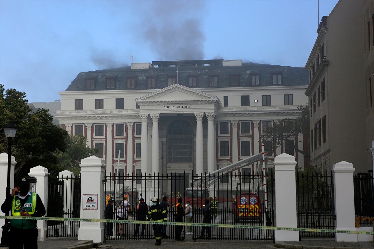 <i>Tsvangirayo Mukwazhi/AP</i><br/>Firefighters battle the fire at South Africa's Parliament on January 2.