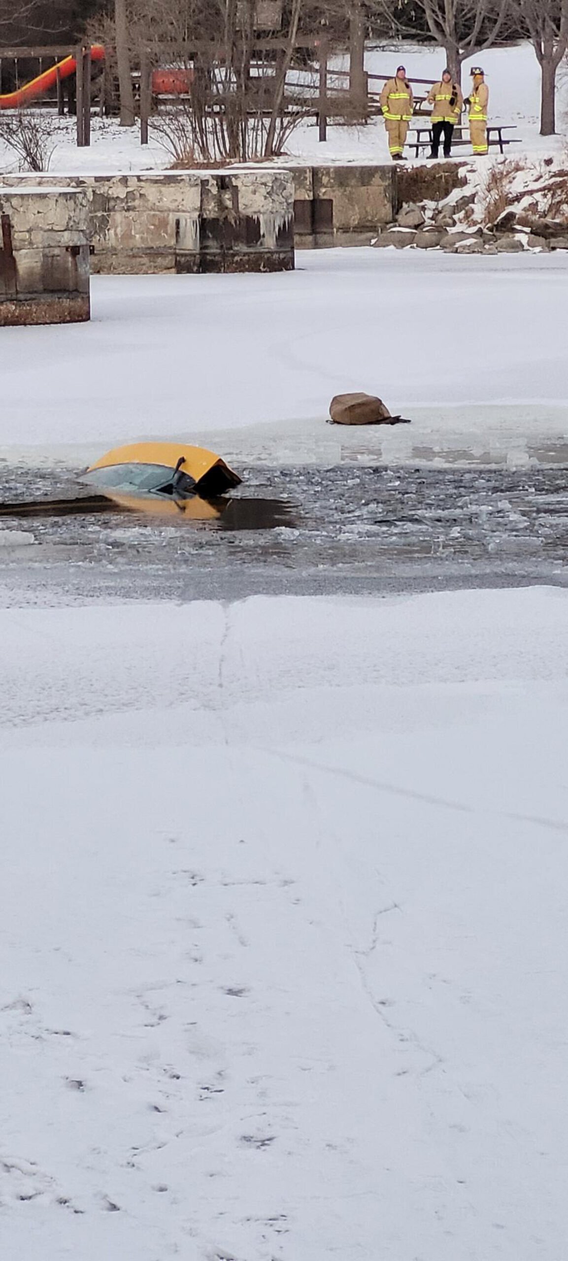 <i>Ottawa Police</i><br/>The car sank in the river after a woman drove across the frozen water.