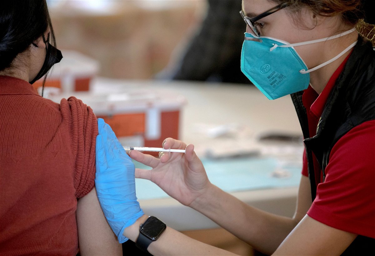 <i>Nick Wagner/Xinhua/Getty Images</i><br/>A medical staff member inoculates a person with a dose of COVID-19 vaccine at a vaccine clinic in San Antonio