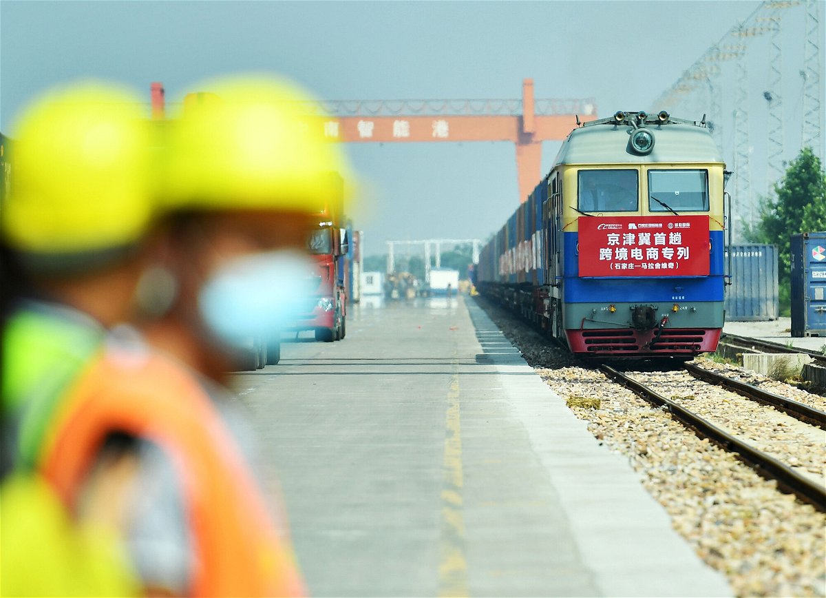 <i>Zhai Yujia/China News Service/Getty Images</i><br/>A train carrying 50 containers departs from China's Shijiazhuang International Land Port to Malaszewicze port in Poland on September 9