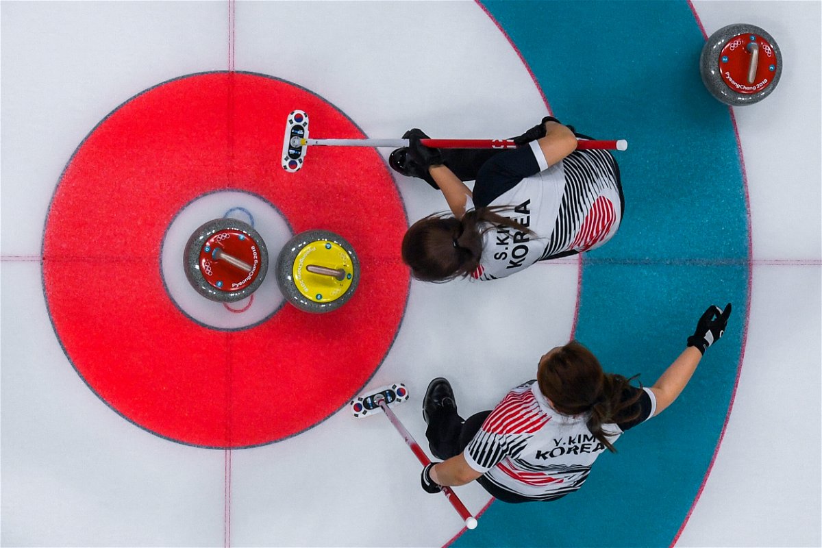 <i>François-Xavier Marit/AFP/Getty Images</i><br/>South Korea's Kim Seonyeong and Kim Yeongmi compete during the curling women's gold medal game between South Korea and Sweden during the Pyeongchang 2018 Winter Olympics.