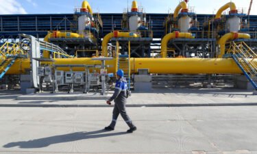A worker walks in a gas treatment unit at the Slavyanskaya compressor station