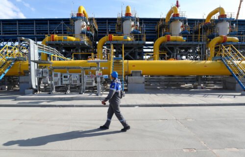 A worker walks in a gas treatment unit at the Slavyanskaya compressor station