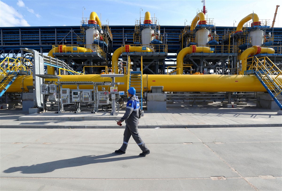 <i>Peter Kovalev/TASS/Getty Images</i><br/>A worker walks in a gas treatment unit at the Slavyanskaya compressor station