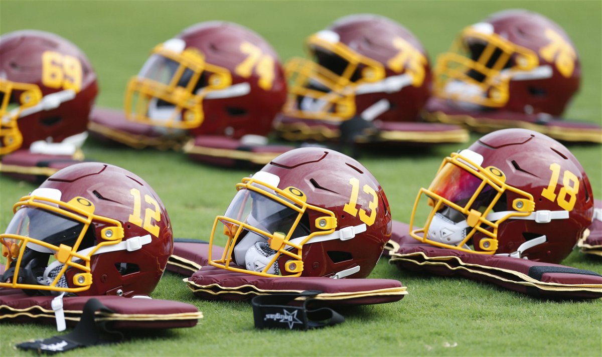 <i>Dean Hoffmeyer/AP</i><br/>Team football helmets are lined up before practice during the Washington Football Team's training camp.