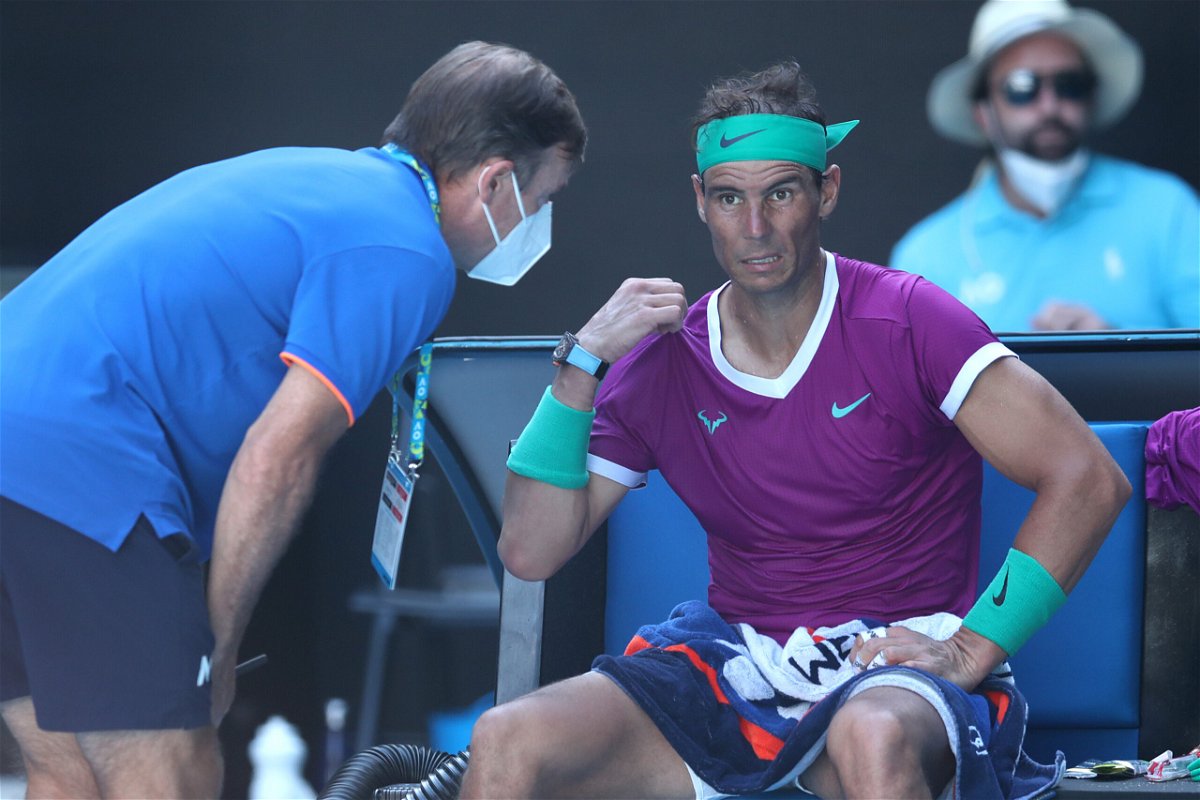 <i>Graham Denholm/Getty Images AsiaPac/Getty Images</i><br/>Rafael Nadal receives attention during a medical time out in his quarterfinal match against Denis Shapovalov.