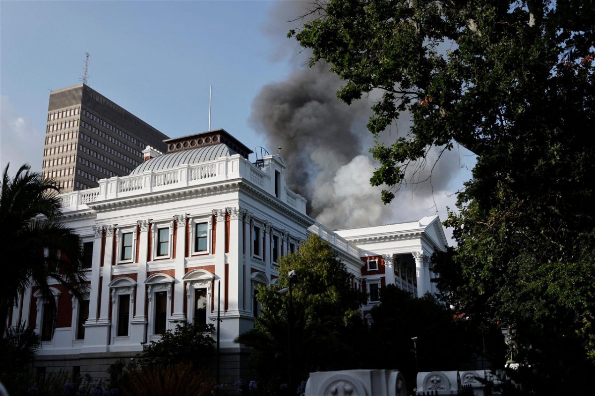 <i>MARCO LONGARI/AFP/AFP via Getty Images</i><br/>A large fire tore through South Africa's parliament in Cape Town