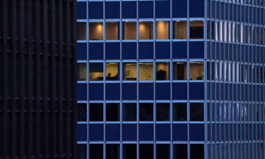 Employees work in an office building in Midtown New York City