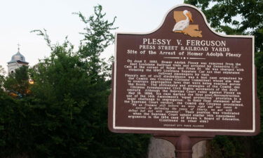 A historical sign marking the arrest site of Homer Adolph Plessy in New Orleans