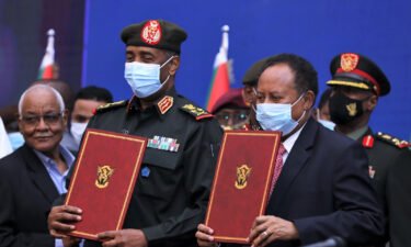 Gen. Abdel Fattah al-Burhan and Prime Minister Abdalla Hamdok sign the political agreement in Khartoum on November 21