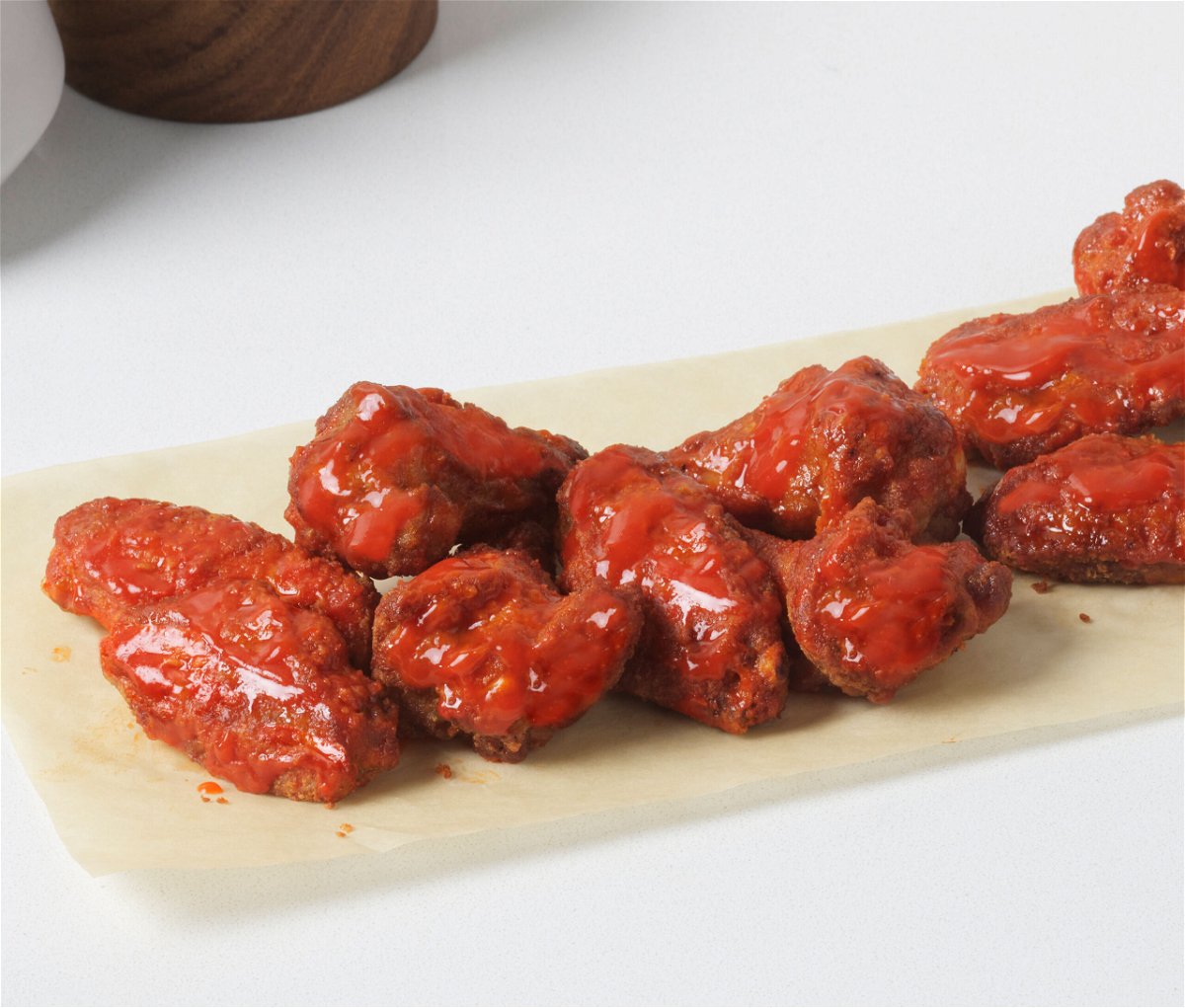 <i>Domino's</i><br/>Domino's Pizza customers ordering chicken wings will soon get fewer of them for the same price.