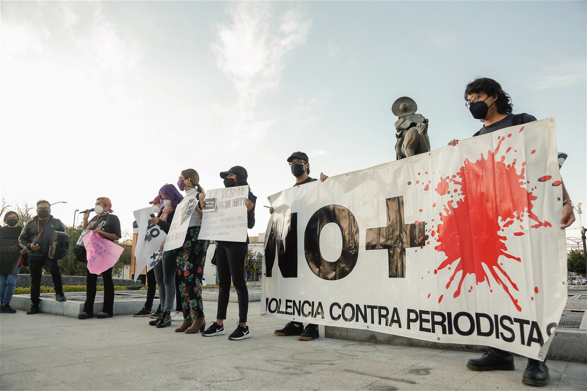 <i>Cesar Gomez/SOPA Images/LightRocket/Getty Images</i><br/>Protesters hold a banner during a demonstration against the murder of the three journalists Jose Luis Arenas