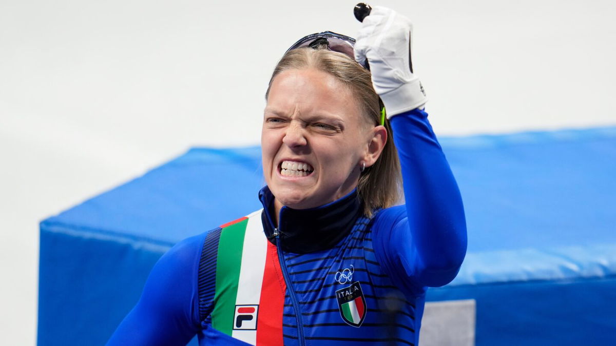 Arianna Fontana celebrates winning the gold medal during the women's 500m final A