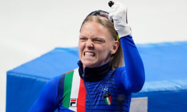 Arianna Fontana celebrates winning the gold medal during the women's 500m final A