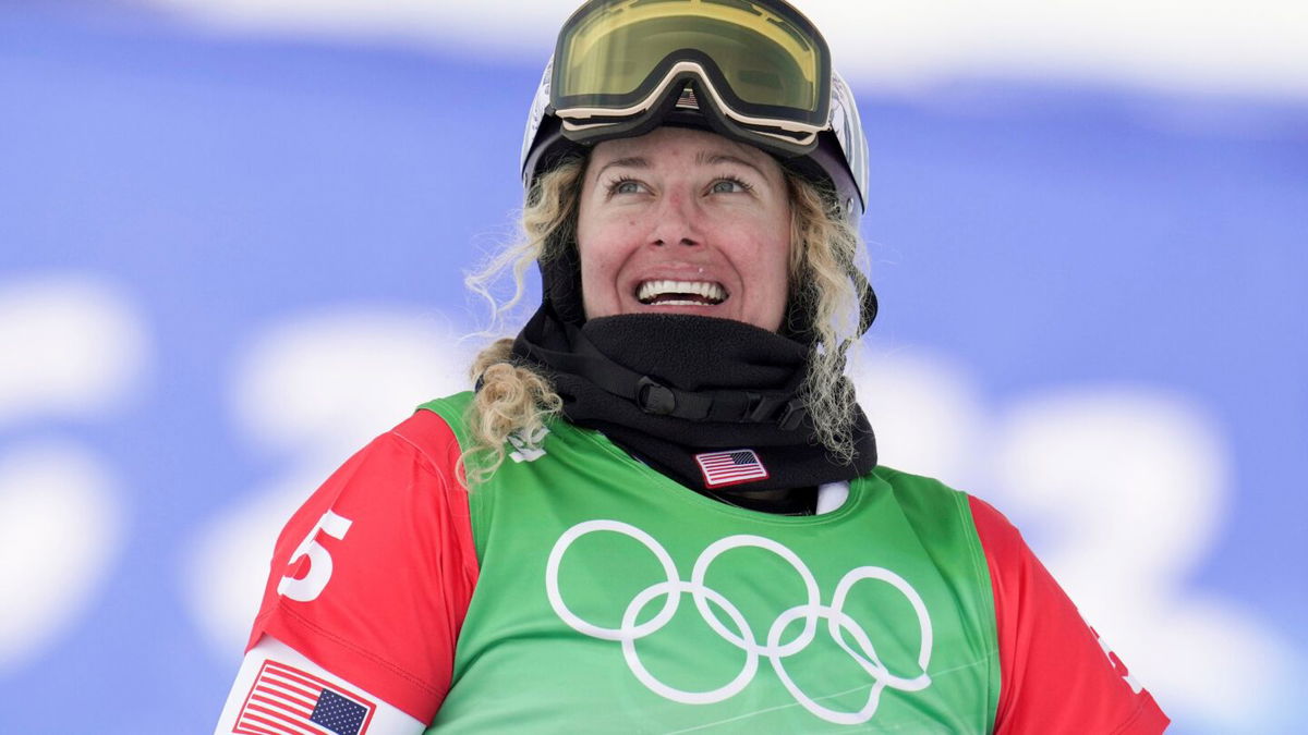 Lindsey Jacobellis reacts after winning the gold medal in the women's snowboard cross final