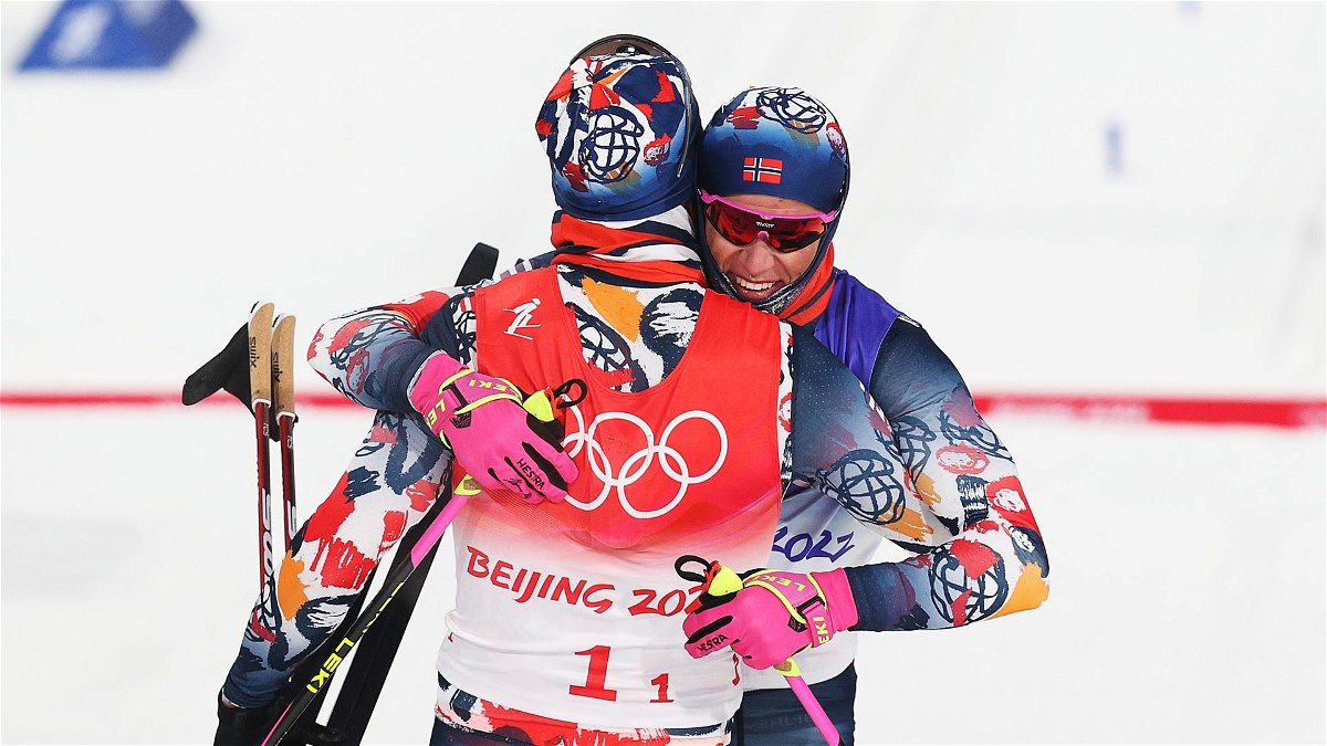 Erik Valnes (L) and Johannes Hoesflot Klaebo of Team Norway celebrate winning the gold medal during the Men's Cross-Country Team Sprint Classic Final