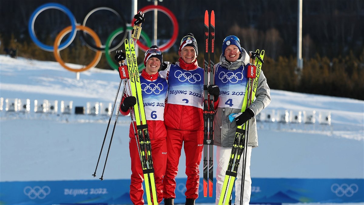Top finishers of the men's cross-country skiathlon stand on podium