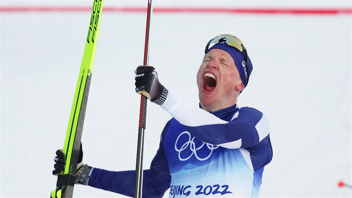 Iivo Niskanen of Team Finland reacts after finishing during the Men's Cross-Country Skiing 15km Classic