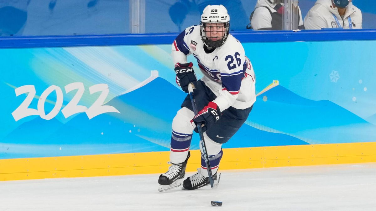 Kendall Coyne Schofield (26) skates with the puck