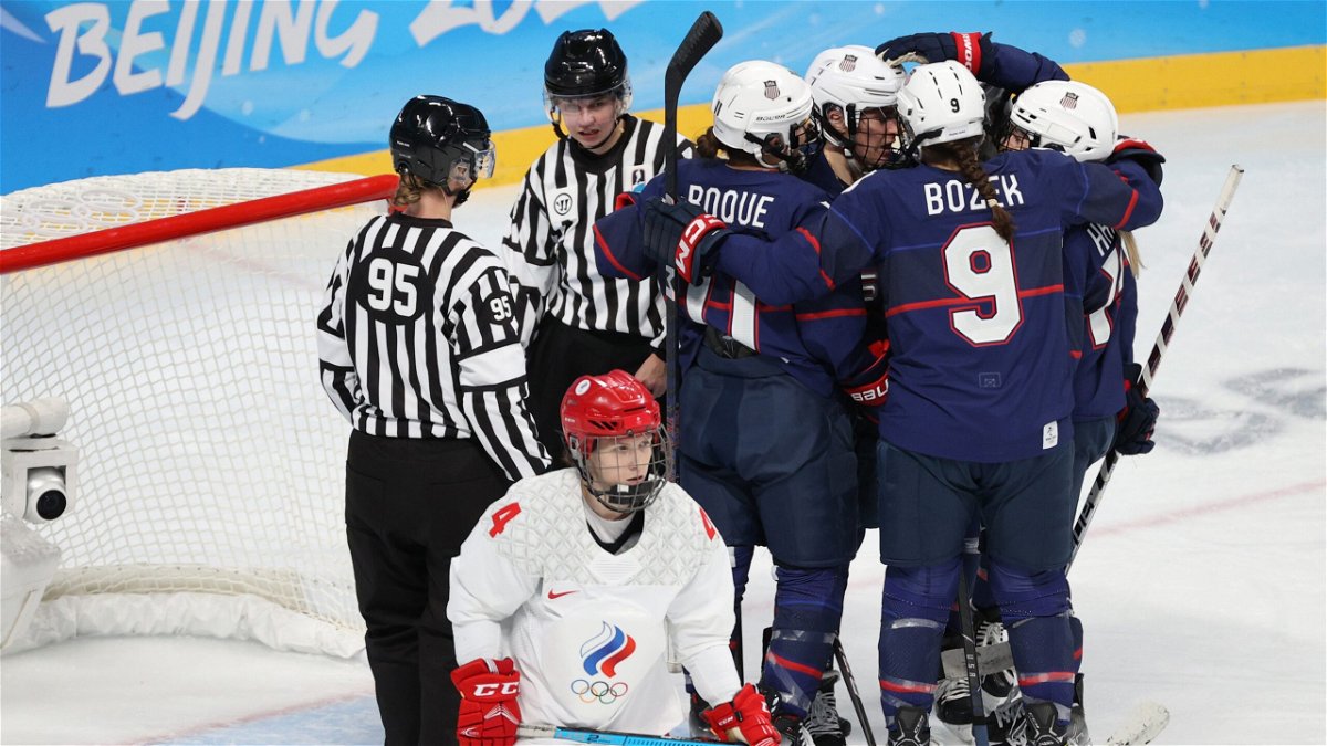 Members of the U.S. women's ice hockey team celebrate a goal against the ROC