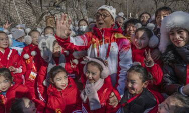 Jackie Chan carries the torch up the Great Wall
