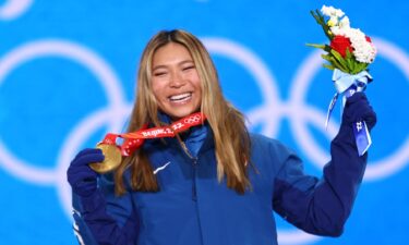 Gold medalist Chloe Kim of Team USA celebrates with their medal during the women's snowboard halfpipe medal ceremony