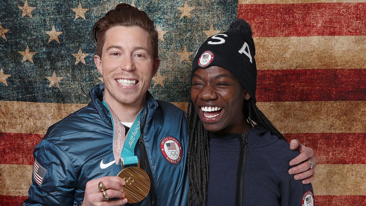 Snowboarder Shaun White of the Team USA poses for a portrait with American speed skater Maame Biney in 2018.