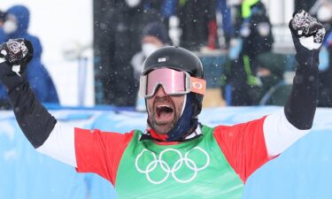 Nick Baumgartner of Team USA celebrates after victory on Day 8 of the 2022 Winter Olympics